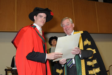 RCSI Recipient Receiving His Parchment from NUI Chancellor Dr Maurince Manning
