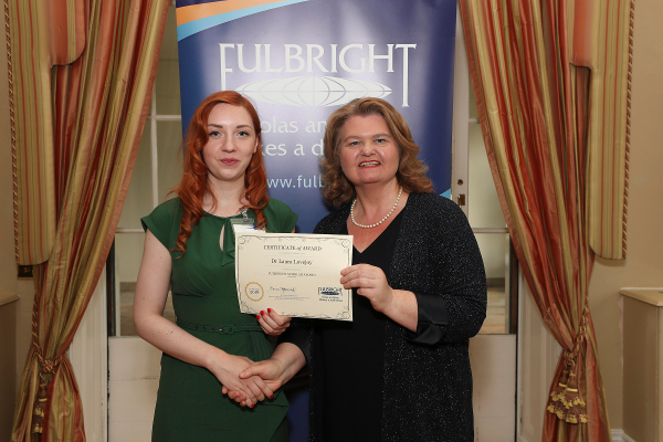 Dr Laura Lovejoy, UCC (L) receiving her award from Fulbright Commission Board Chairperson, Dr Sarah Ingle at the 2018 Fulbright Awards Ceremony in the U.S. Ambassador’s Residence, Deerpark, Dublin.